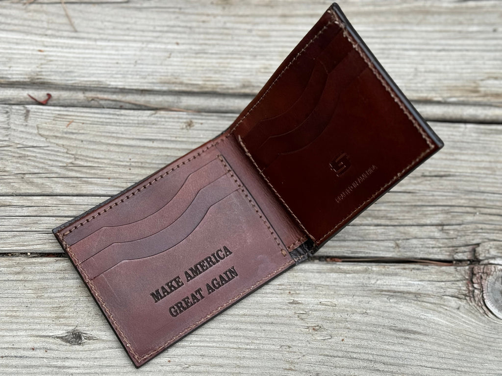 Brown leather wallet with Make America Great Again engraved on it