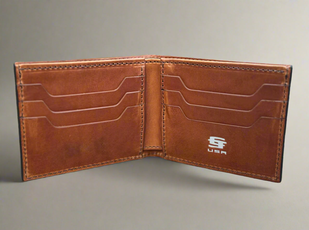 Brown leather wallet with visible brand logo on a wooden surface. Interior of Christoph Joseph Bourbon Bifold